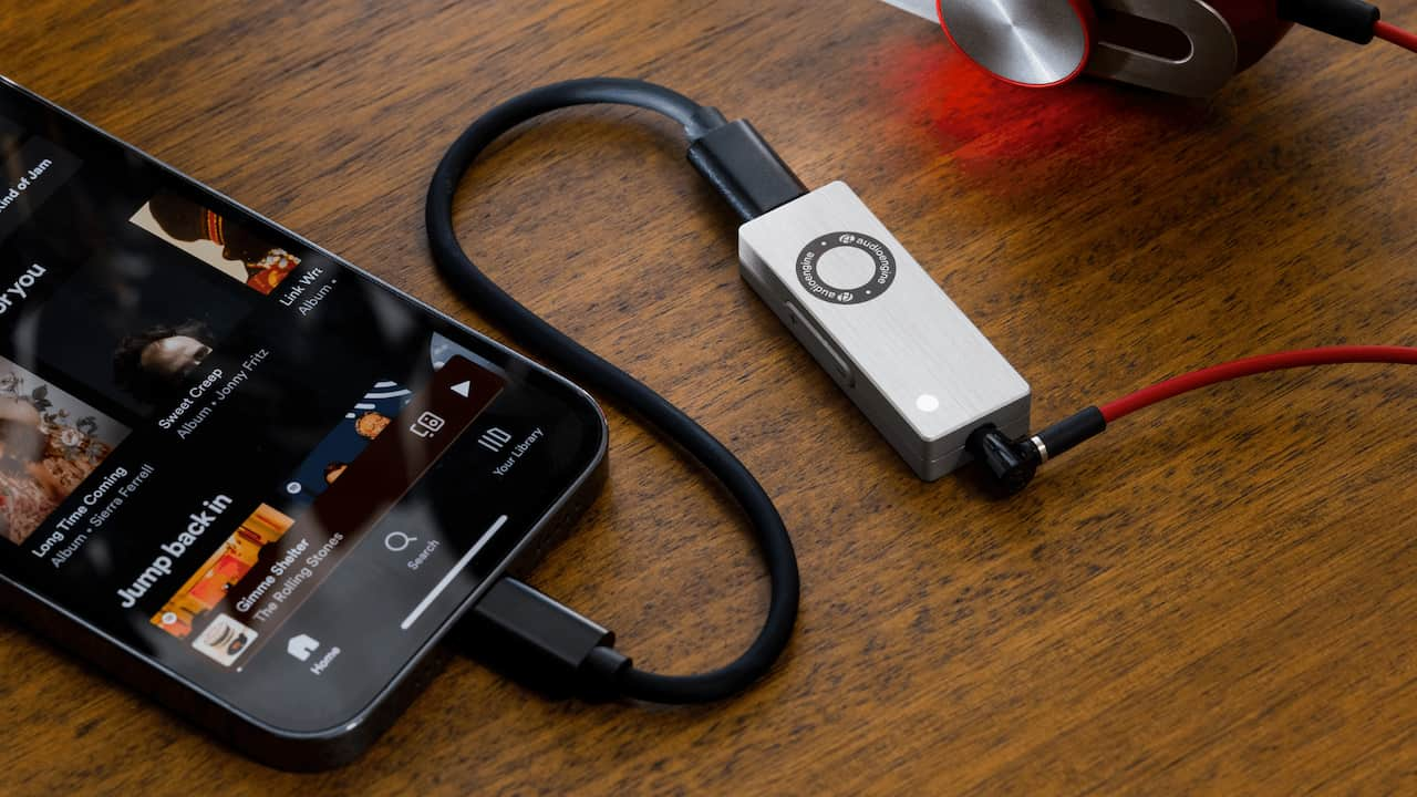 Audioengine DAC3 Dongle DAC connected between smartphone and headphones