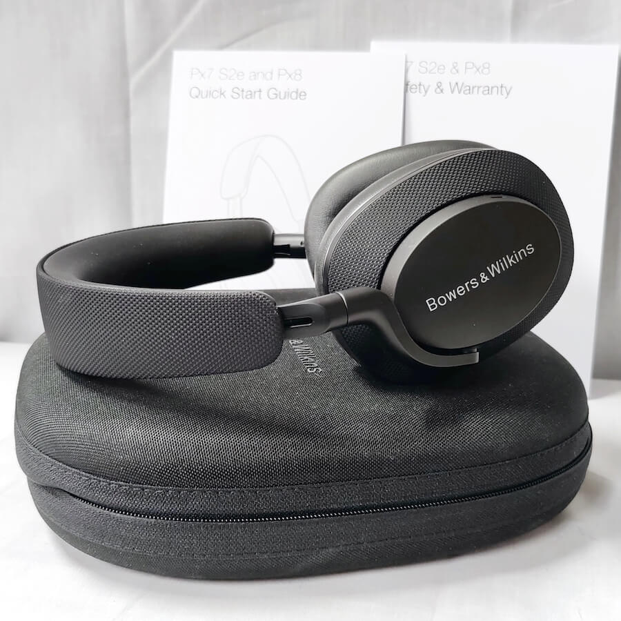 Bowers & Wilkins Px7 S2e Noise Cancelling Wireless Headphones atop Travel Case Black