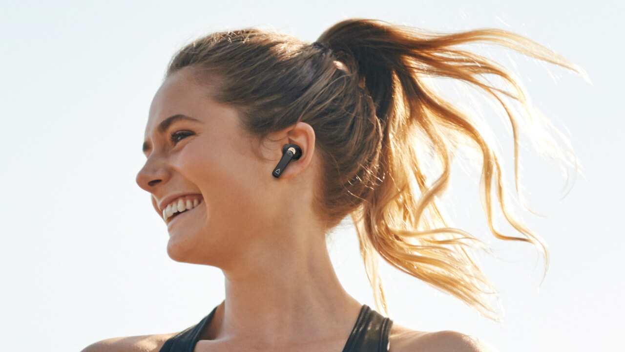 Active woman wearing Man wearing Creative Aurvana Ace True Wireless Earbuds