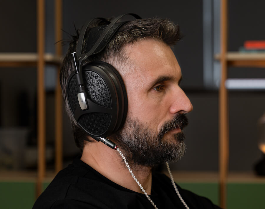 Man wearing Meze Audio Empyrean II Headphones