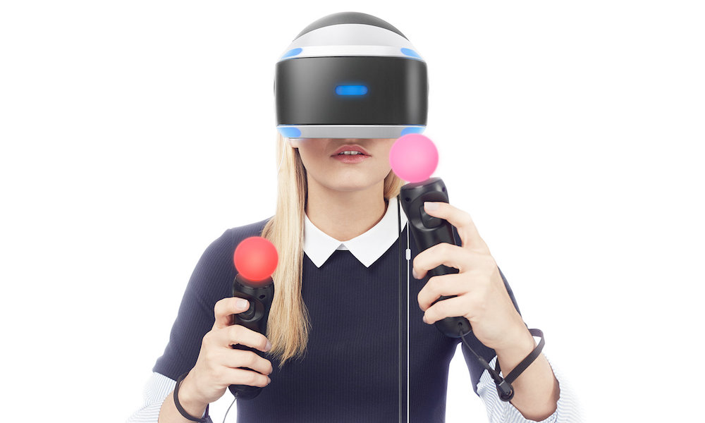 Woman wearing Sony PlayStation VR Headset with Move Controllers