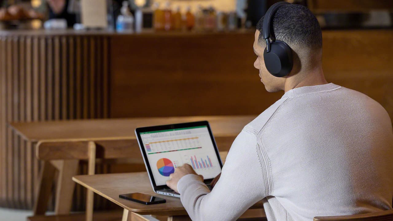 Man wearing Sony WH-1000XM5 Wireless Headphones